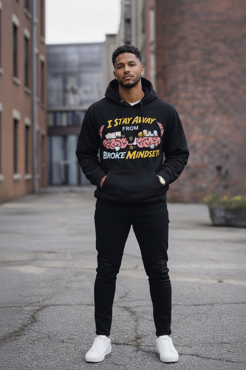 Man wearing a black hoodie with colorful text and graphics